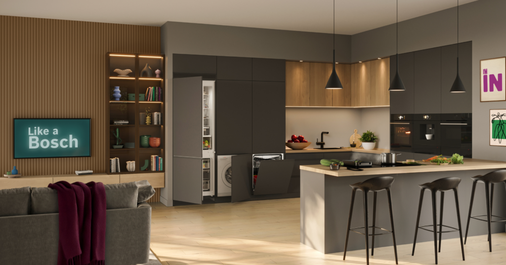 Cocina abierta con lavadora, placa, horno, lavavajillas y frigorífico Bosch.